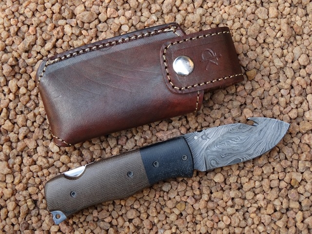 reebok-damascus-folder-with-guthook-dark-brown-micarta-handle-plates