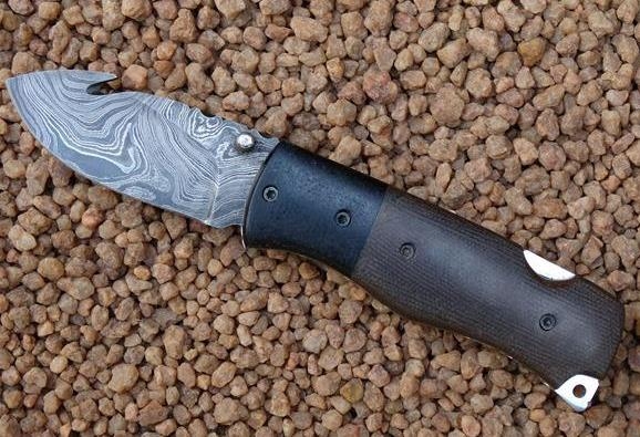 reebok-damascus-folder-with-guthook-hessian-bag-micarta-handle-plates